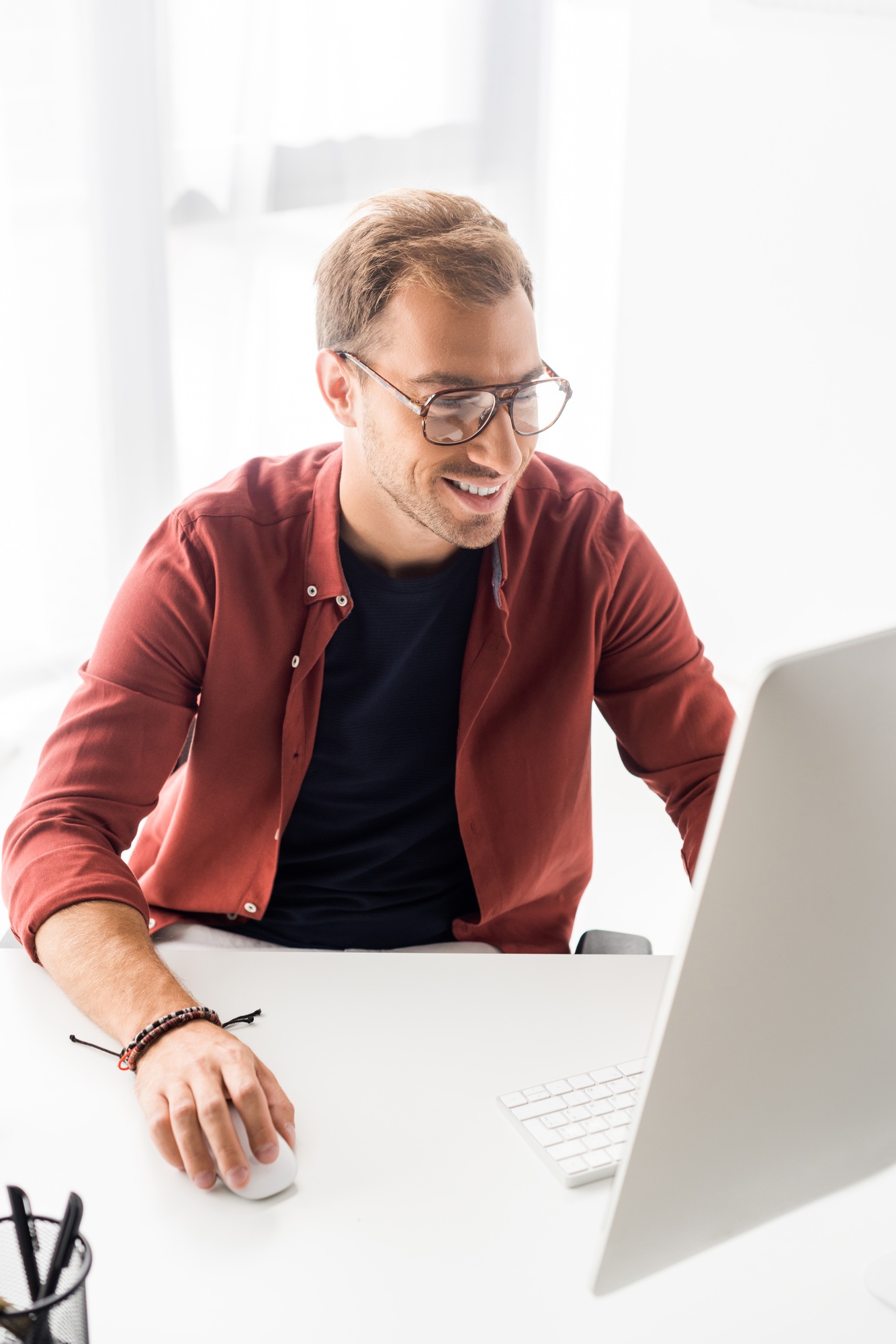 smiling businessman working in modern office